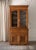 This stunning two-piece stepback cabinet beautifully balances rustic country warmth with refined French architectural...