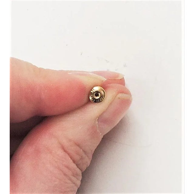 This is part of Chairish’s Costume Jewelry assortment. Matte goldtone and hand carved orange resin bead pierced drop...