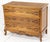 A charming French Provincial / Louis XV–style three-drawer chest, featuring a beautifully sculpted serpentine front,...