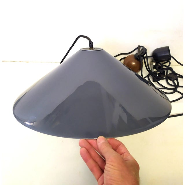 The lamp is original from the 70s and is not a reproduction. The lamp is equipped with a sliding rail to position it as...