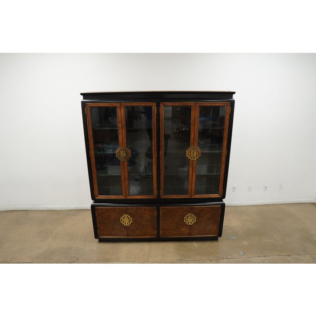 This vintage Century Chin Hua display cabinet, designed by Raymond Sobota, embodies refined Asian Chinoiserie style with a...