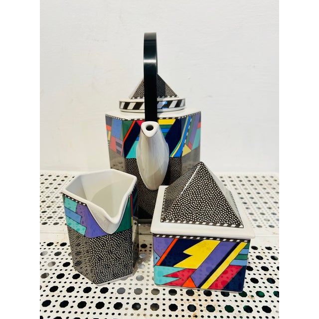 A Memphis style tea set (teapot, cream and sugar) designed by Barbara Brenner and manufactured in Germany by Rosenthal....
