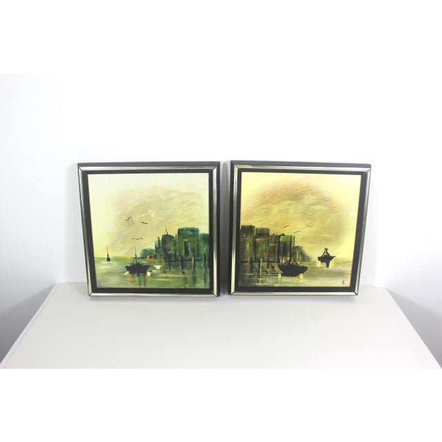 This is a pair of framed mid century paintings of nautical scenes. The paintings are on stretched canvas in wood frames....