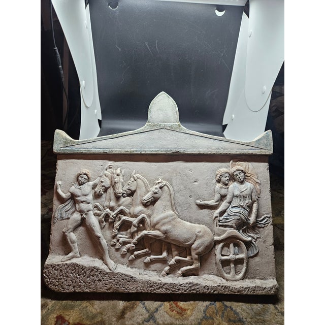 reproduction of a classical Greek votive relief depicting the abduction of the nymph Basile by the hero Echelos, driven by...