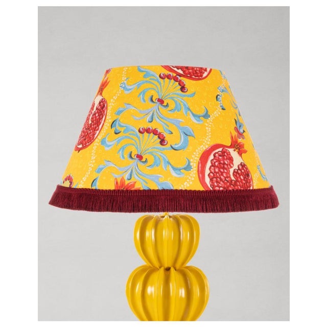 Vibrant hues of pomegranate burst forth, infusing any space with vitality through the MELAGRANATA lamp, a piece that...