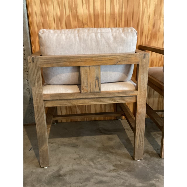 Exceptional set of four handcrafted solid elm wood chairs, showcasing exposed joinery and refined craftmanship. The...