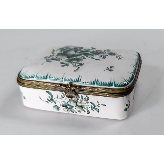 We are selling this very pretty French Faience pottery box. This box has attractive green floral decoration with feathered...