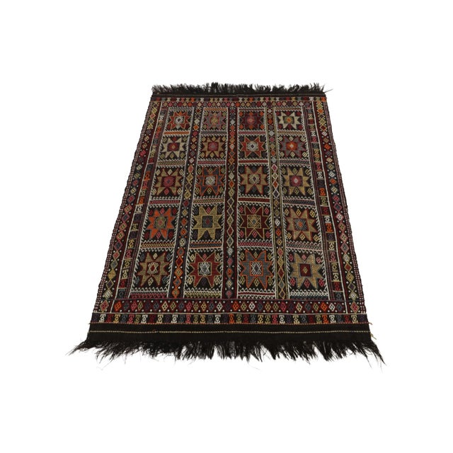 A vintage Kilim rug in 5x8, from the latest curation of the Cecim tribal rug family joining our acclaimed collection....