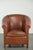 This English-style cowhide club chair has a luxurious look and offers excellent seating comfort. It features a fixed seat...
