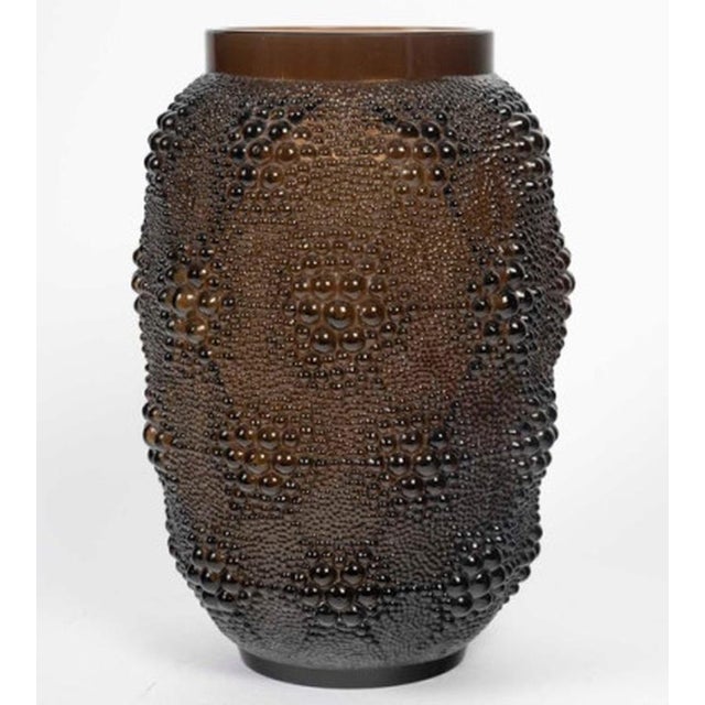 1932 René Lalique - Davos Vase "Davos" vase in amber-brown tinted glass. Model created by René Lalique in 1932 and...