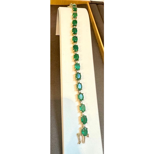 This exceptionally affordable Tennis bracelet has 19 stones of oval Emeralds . Each Emerald is spaced by two diamonds ....