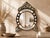 Vintage-style handcrafted wall mirror featuring an intricate inlay pattern set into a solid wooden frame. This decorative...