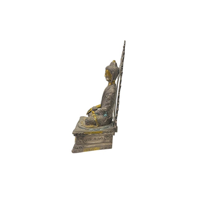 The Vintage Chinese Distressed Pewter Color Metal Sitting Shakyamuni Statue with copper color body accents is a...