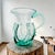 This Liberty Village Glasshouse lily pad pitcher was hand-blown in Liberty Village, New Jersey, in 1976. Executed in free-...