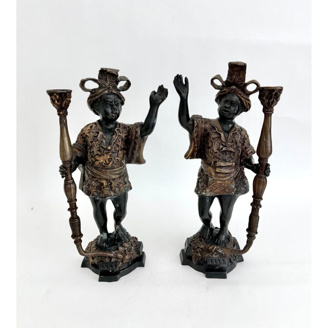 This stunning pair of vintage Mid-Century bronze figural candlesticks are crafted with exceptional texture and detail. The...