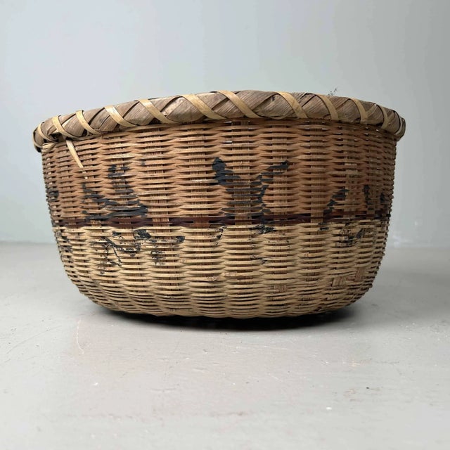 Traditional Hand-Woven Japanese Basket, 1950s. Dimensions: Height: 19 cm, diameter: 37 cm The combination of bamboo and...