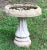 Very nice concrete bird bath with swirl design on base and a raised design in bowl for the smaller birds to stand on....