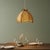 Large vintage 1960s hanging light made of plywood and rattan. When lit up, it creates fantasy lighting patterns. It comes...