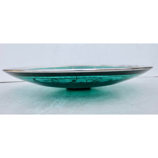 Silver overlay Venetian center bowl. Dark green transparent glass with silver design overlay. Imagery of a fashionable...