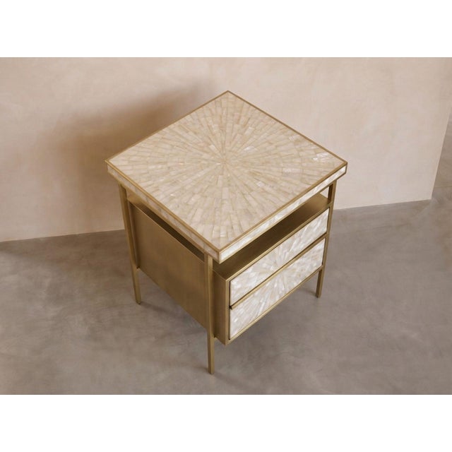 A refined expression of natural mother-of-pearl and brushed brass, the Arcana Bedside Table brings luminous artisanal...
