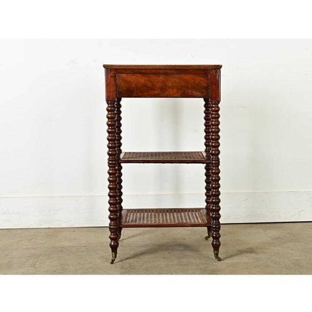 Dimensions: 27 ⅞” H x 16 ¼” W x 16 ½” D A walnut etagere with bobbin legs from France, circa 1870, full of personality and...