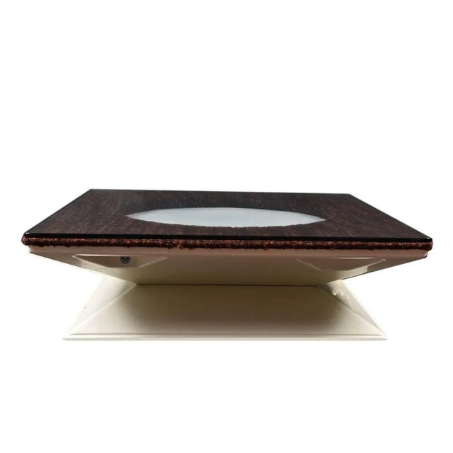 This coffee table was produced by M.I.M. Roma in the 1970s and has an illuminating circle in the center with bouclè. This...