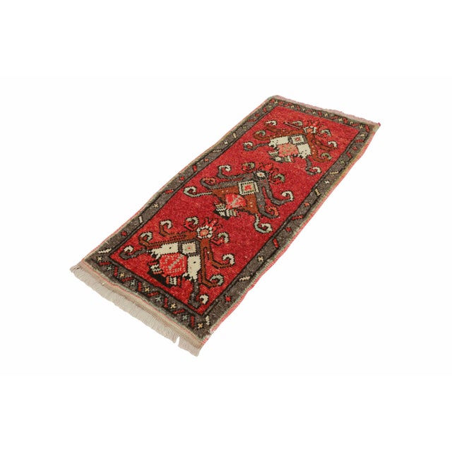 Vintage Handknotted decorative mini rug from Kars region of Turkey. Approximately 45-55 years old. In very good condition.