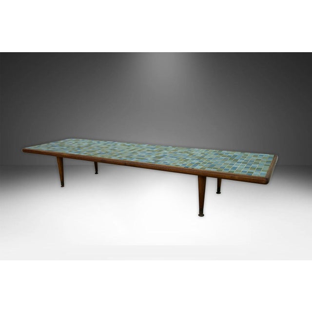 This beautiful mid-century modern low 10" tall coffee table features a rectangular top with inlay of mosaic ceramic tiles...