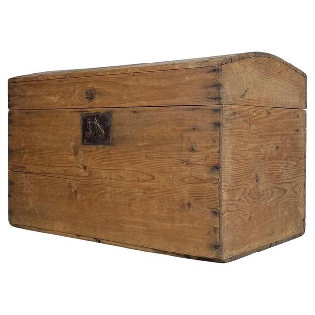 A charming 19th-century English dome-top trunk, crafted from pine and distinguished by its compact proportions,...