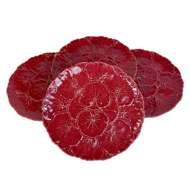 This is a set of deep garnet red majolica dinner plates in the cabbage ware style. These hand painted "Faiancas" are...