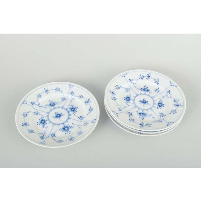 Royal Copenhagen Blue Fluted Plain, side plates, late 20th century. Set of four porcelain plates, hand-painted in the...