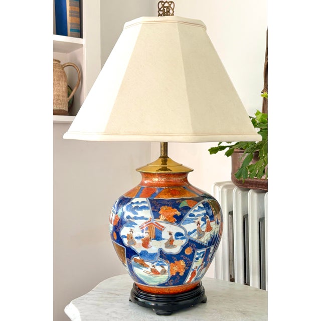 Made from a vibrant Imari vase, this midcentury table lamp features an ornate hand-decorated design in blue, orange, gold,...