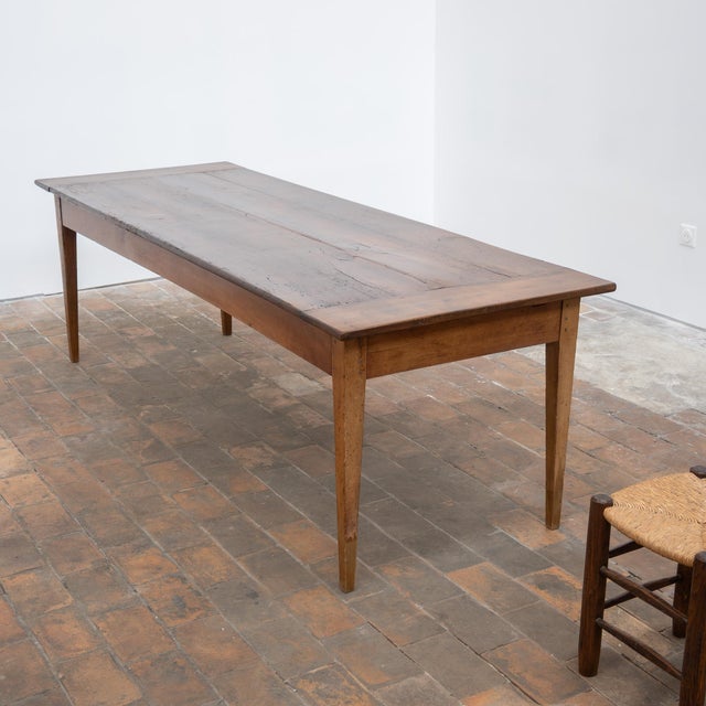 Large solid wood farmhouse table dating from the 19th century. Rectangular top with a beautiful antique patina, marked by...