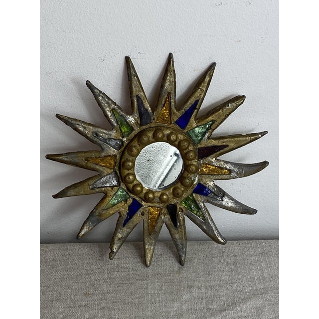 Antique lead sunburst mirror in the style of Line Vautrin, attributed to her student, the artist Irena Jaworska. A refined...