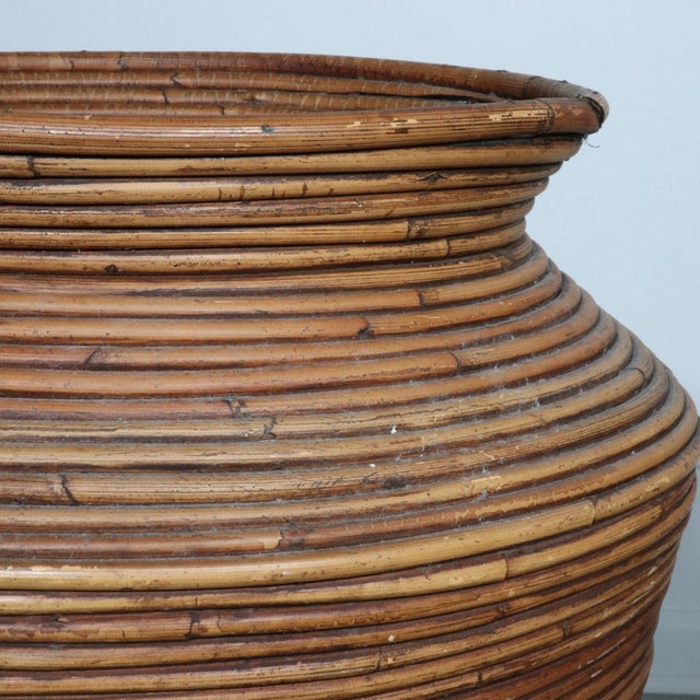 Stunning pair of 1970’s split pencil reed floor vases in the style of Gabriella Crespi. They are each unique to themselves...