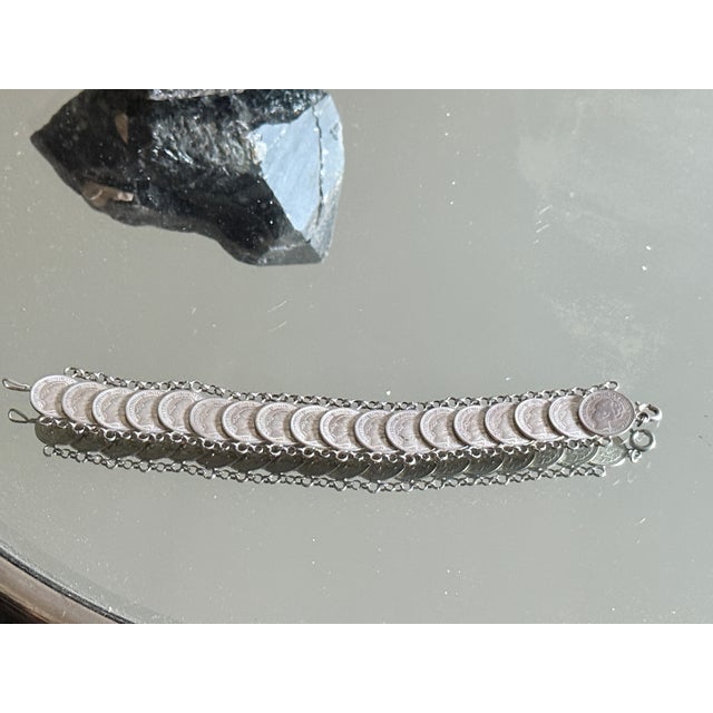 Vintage coin style bracelet featuring decorative reproductions modeled after Dutch 10 cent “dubbeltje” coins dated 1941....