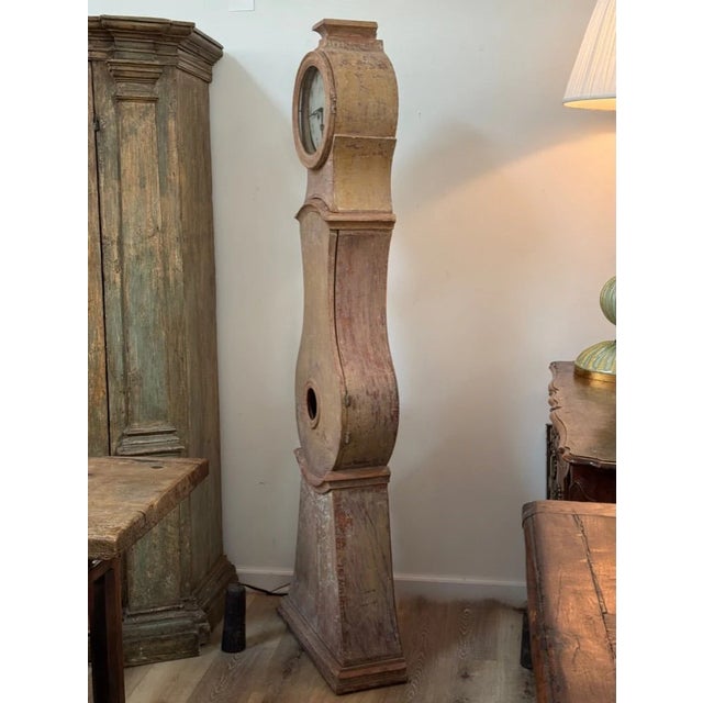 Early 19th C. Swedish Mora or floor Clock having original pale terracotta tone paint with original works. Chairish sells...