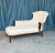 Classic French 19th century Napoleon III tufted chaise lounge with exposed wooden details on the arms. The chaise has been...