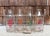 Four vintage quart milk bottles in a wood-handled wire carrier--perfect to display flowers and add character to your...