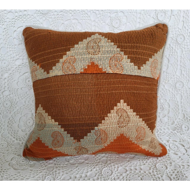 A gorgeous kantha cloth throw pillow, featuring a burnt orange and reddish brown paisley print. Perfect for many types of...