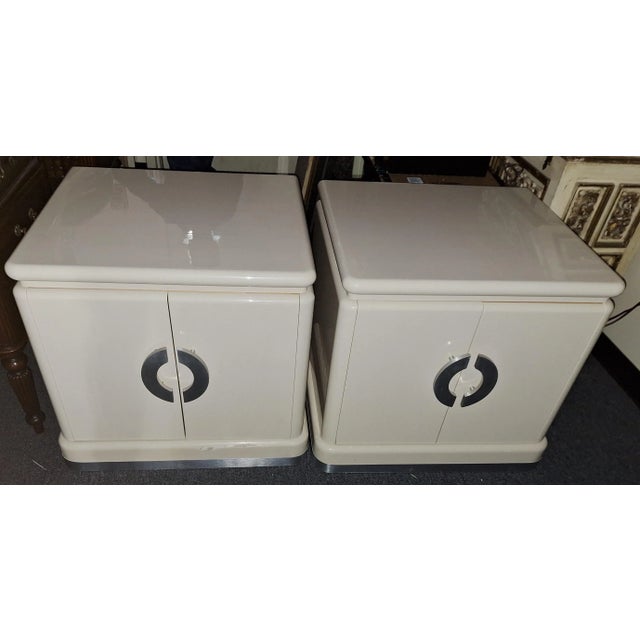 Pr. of custom lacquered cabinets designed by Jay Spectre measure 26'' d x 27'' w x 25''h. They do have some chipping to...