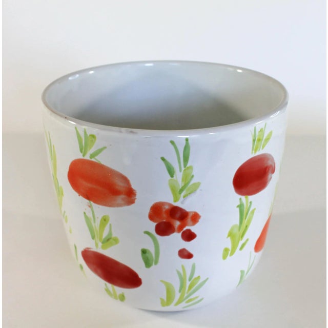 Glazed terracotta planter with painted fruit and green foliage. Made in Italy. Makers mark on bottom. Minor signs of wear....