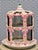 A striking large French Rococo-style hand-painted porcelain bird cage, standing an impressive 20 inches tall. This ornate...