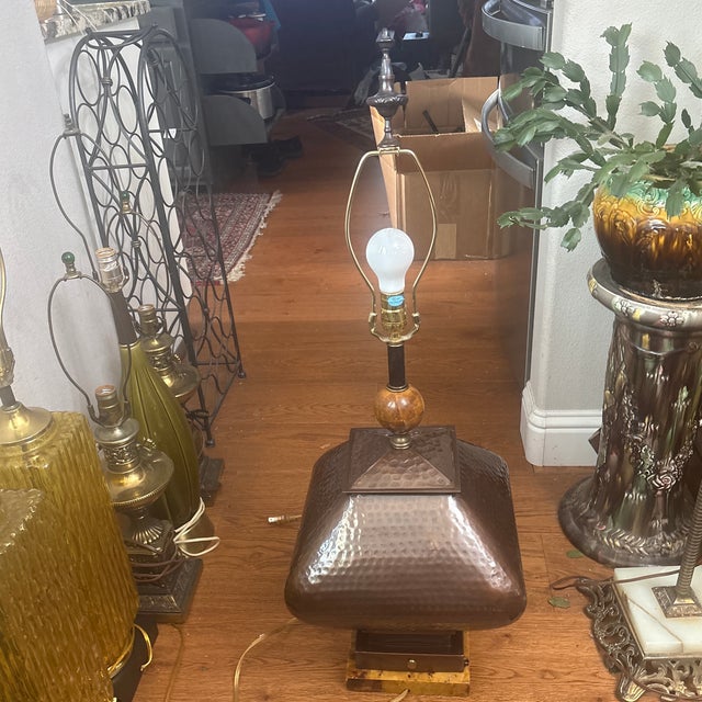 This is a nice Mid Century Hand Hammered Copper and Bronze Lamp with a Marble Base and Accent on the Neck. It is very nice...