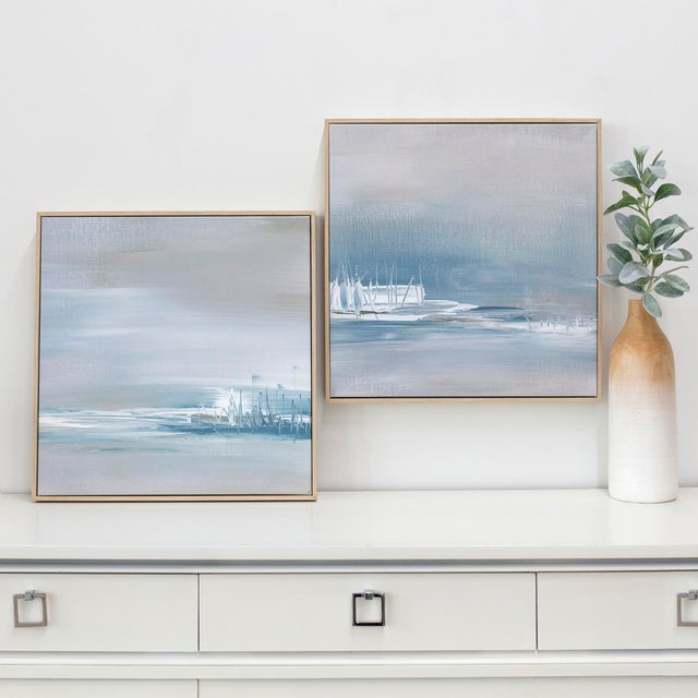 This serene two-piece set explores the quiet horizon where water, light, and atmosphere meet. Soft washes of blue and gray...