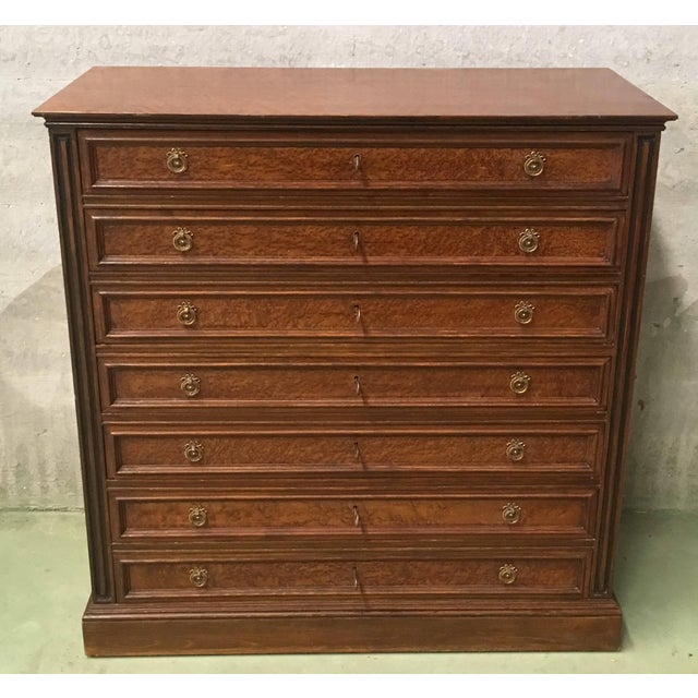 Seven-drawered French chest of drawers or Semainiere, dresser. The chest shows fluted three-quarter columns on the corners...
