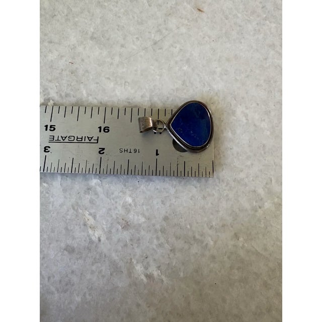 Handcrafted 925 sterling silver teardrop pendant featuring a deep blue lapis lazuli.