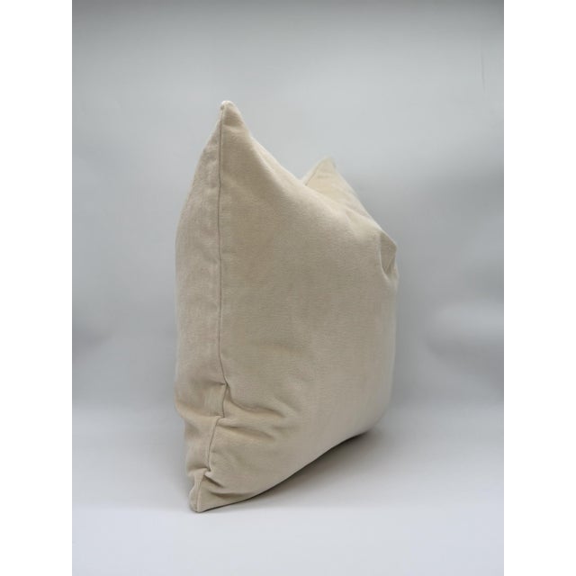 Handcrafted from plush velvet in a soft vanilla-beige hue, this decorative throw pillow cover brings effortless...