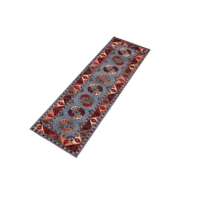 Enhance the ambiance of your home with this magnificent Persian-influenced Turkish hand-knotted rug made by skilled...