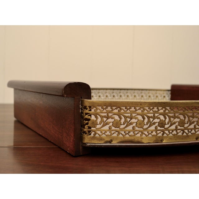 Large scale mahogany serving tray with a unique detailed gilded gallery and wood handles. Modern interpretation of...